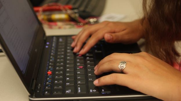 The pink markers on Maysie Gonzales’ laptop offer a tactile reference point from which she can better orientate herself